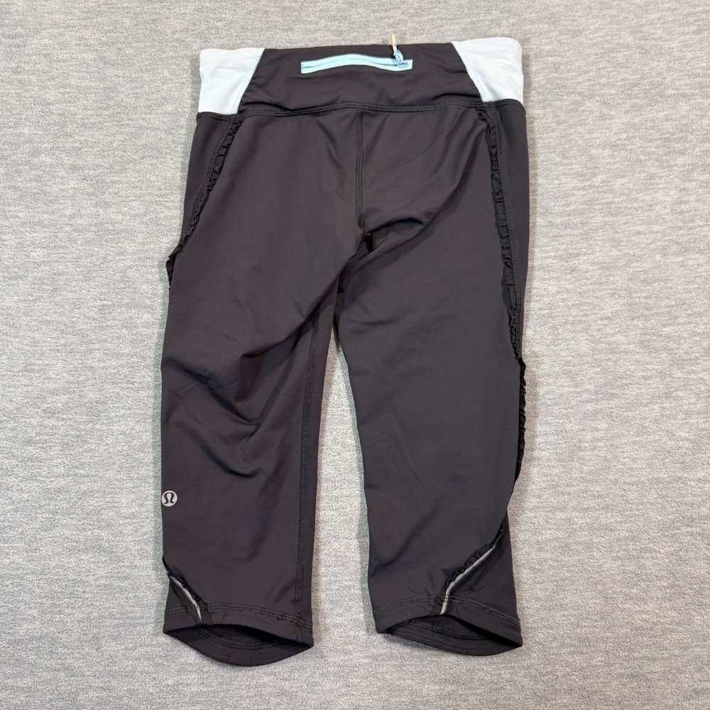 Lululemon Crop Leggings Women's Size 4 Black Blue Trim Zipper Hem 22x16‎